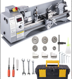 Metal lathe with accessories and tools.