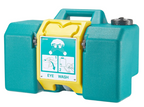 Portable emergency eye wash station positioned inside a warehouse safety area for quick emergency response.