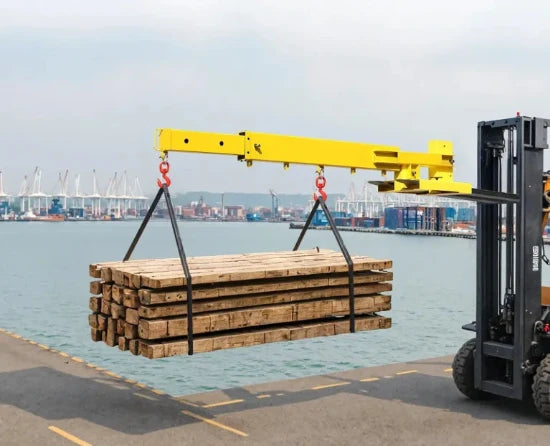 Manual telescoping forklift jib boom attachment moving oversized industrial materials safely and efficiently.